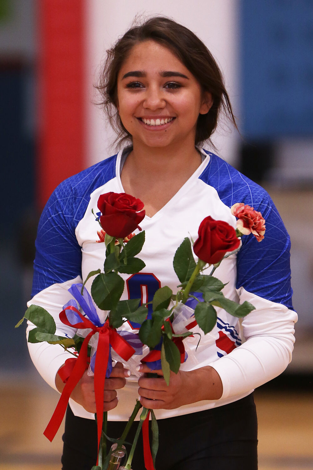 Mary Cleveland carries flowers out to meet her family